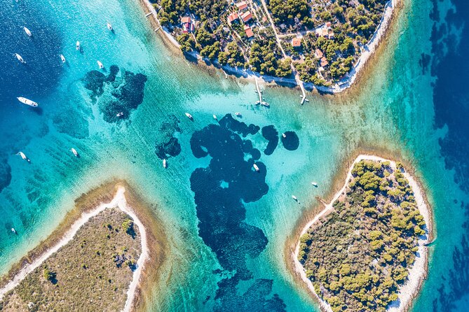 Blue Lagoon & 3 Islands Private Boat Tour - Entering Trogir: a UNESCO town stop that stays human