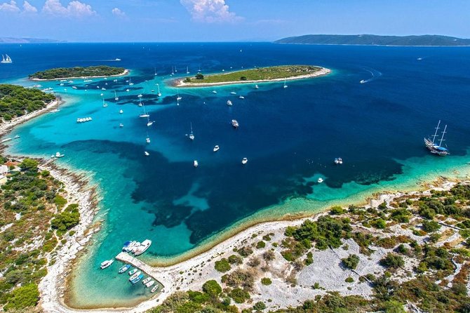From Split: Half-Day Blue Lagoon and 3 Islands Boat Tour - Trogir for photos and coffee: a short historic hit