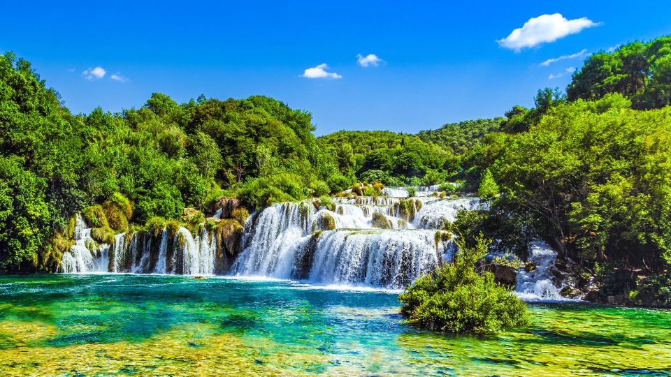 From Split & Trogir: Krka Waterfalls Day Tour with Boat Ride - Skradin on your own: beaches, lunch, and getting back on time