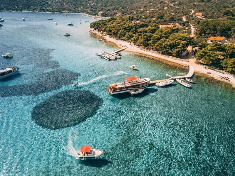 From Trogir: Blue Lagoon & Šolta Cruise with Lunch & Drinks - The open-water cruise out: scenic views with a welcome drink