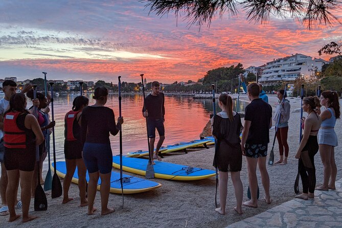 Glowing Stand-Up Paddle Experience in Split - Back to the sea: Stobreč white rocks and cliffside homes