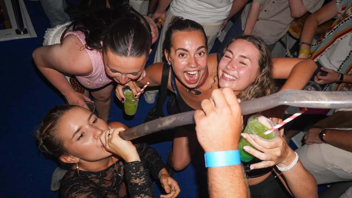 Split: Boat Crawl with Nightclub Access, Shots, & Boat Party - Night on the water: the two-bar party boat with live DJ