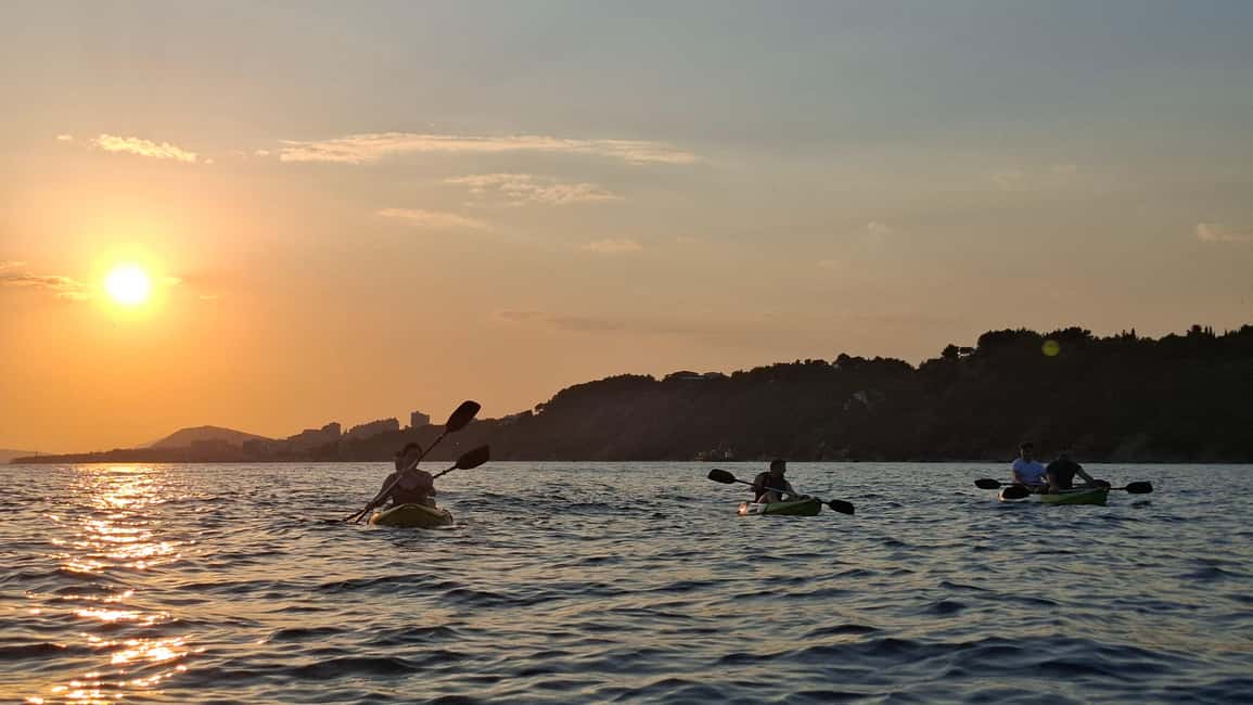 Split: Sunset Guided Kayaking Tour - Open sea at golden hour: swimming, walking, and the cliffs